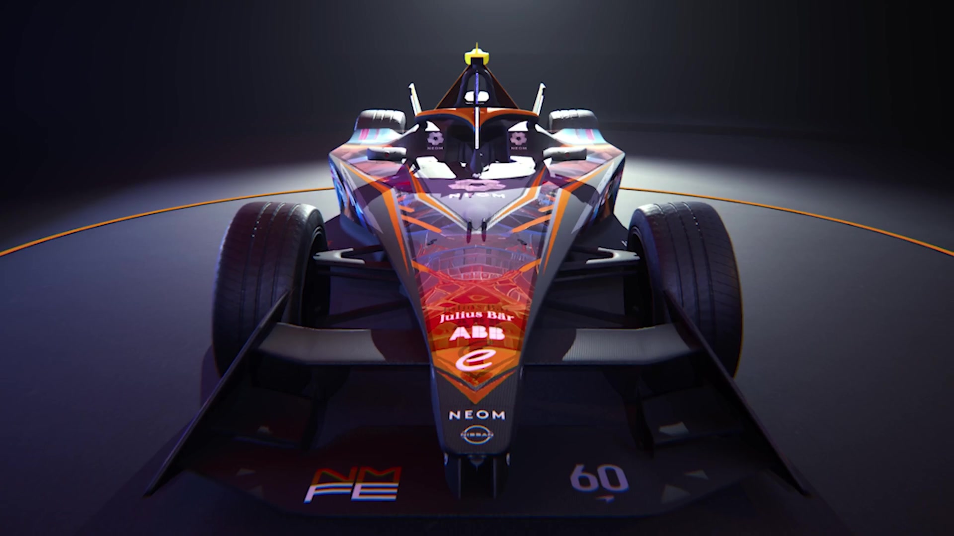 The NEOM McLaren Formula E car head-on under a single light